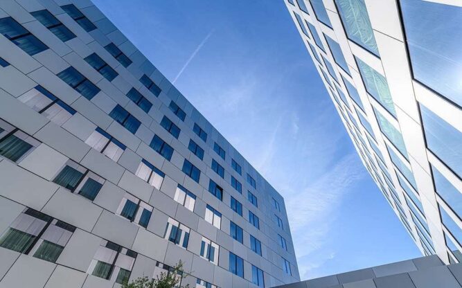 The side view of a hotel with lots of windows