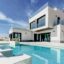 A white multi-story villa with large open windows and a crystal clear swimming pool running along the front.
