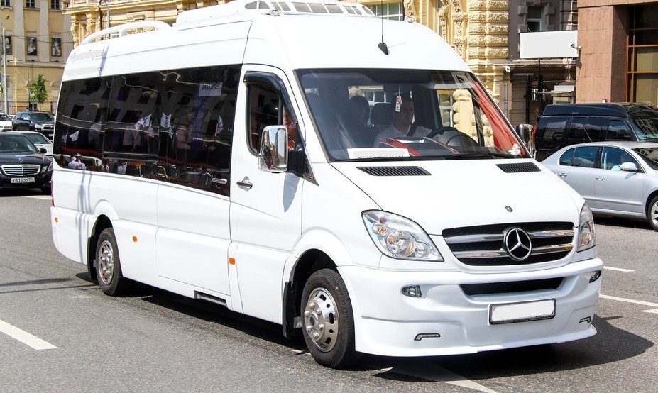Dubrovnik Airport Taxi (Minibus) - Welcome Pickups A white Mercedes minibus driving down the street.