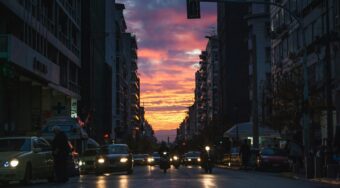 Sunset in downtown Athens with car traffic