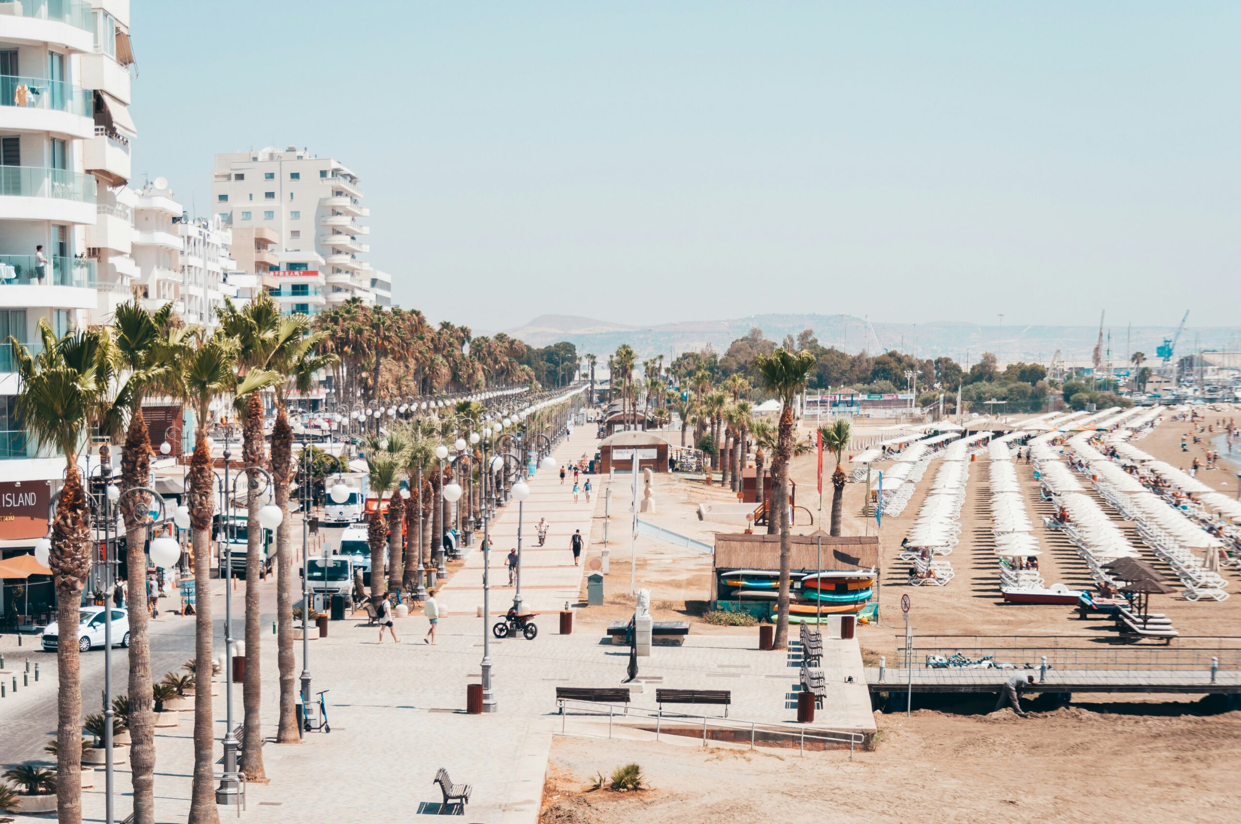 Aerial view of Larnaca beach and the buildings on a sunny day. Take a Larnaca taxi and start exploring.