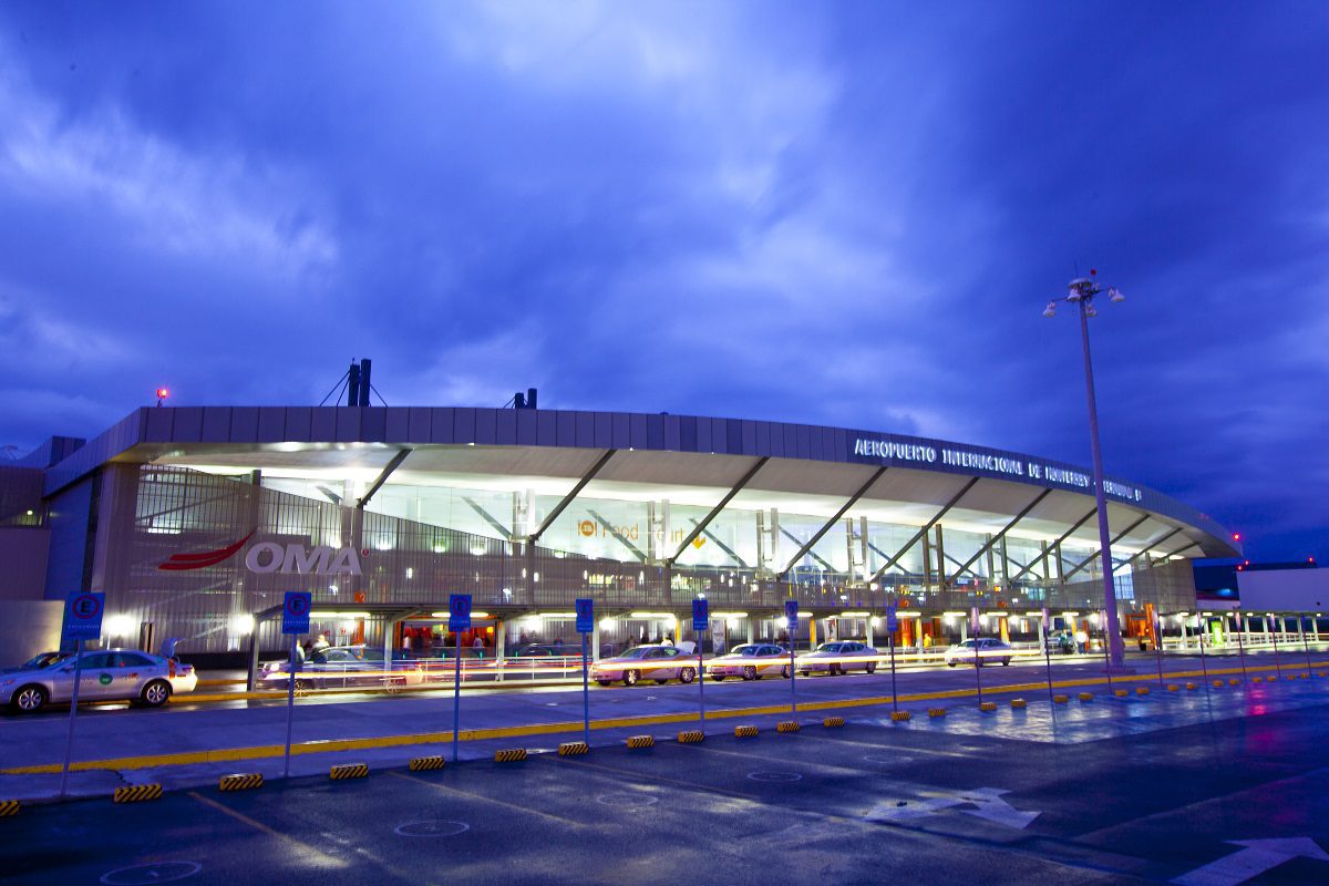 outdoor view of Monterrey Airport at dusk under a cloudy sky