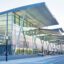 outdoor view of Wroclaw Airport's glass walls and overhanging roof