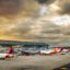 Bogota, Colombia - January 23, 2023: Avianca and Ultra planes parked in a terminal of El Dorado airport during sunset