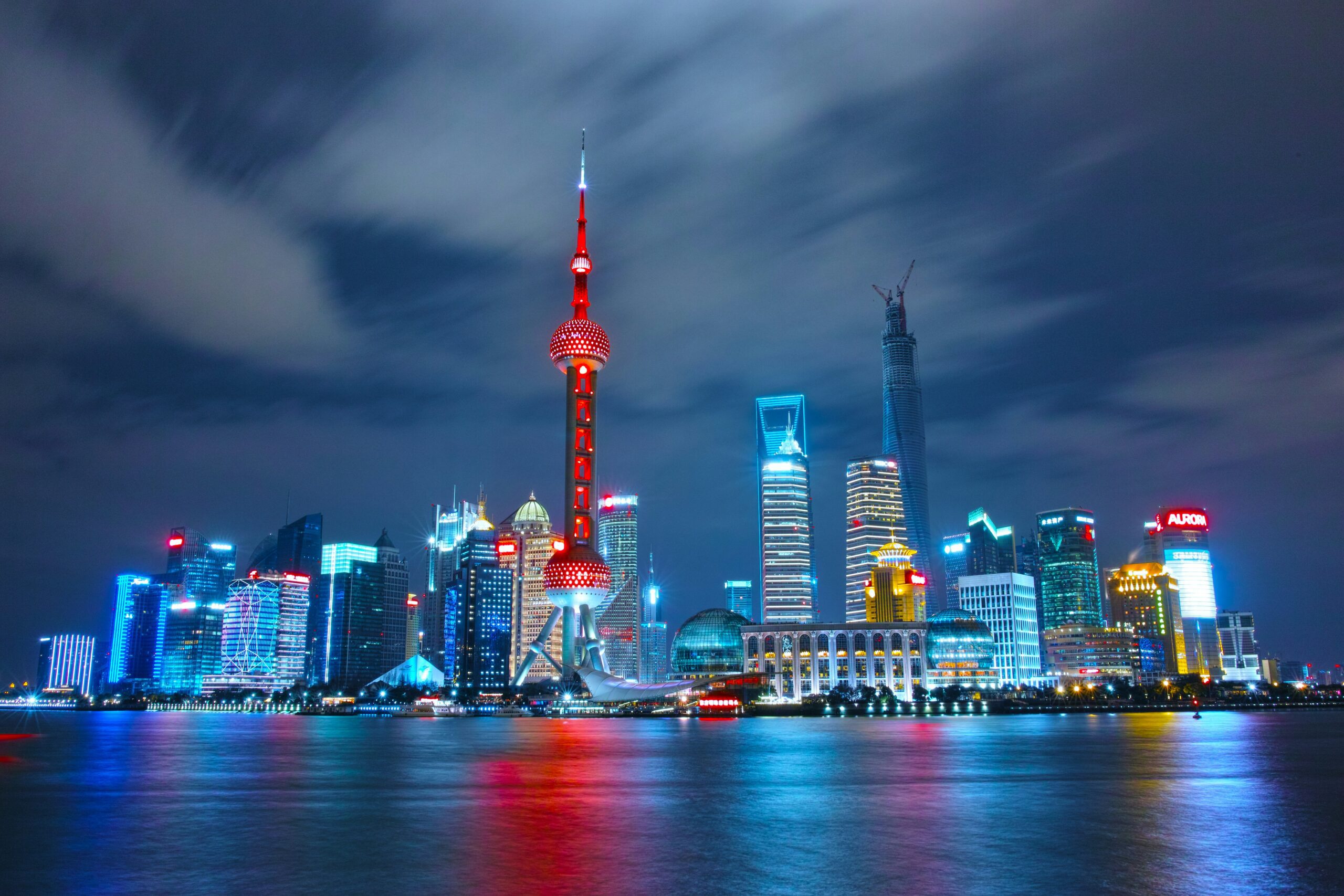 A view of Shanghai city lit up at night reflected in the water
