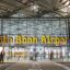 The entrance to Cologne Bonn Airport with a large airport sign