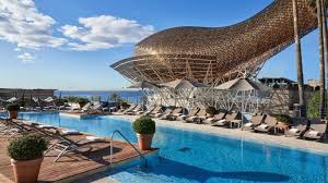 View of the pool and sculpture at Hotel Arts