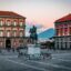 Piazza del Plebiscito at sunset with the Royal Palace and Mount Vesuvius in the background, Naples, Italy